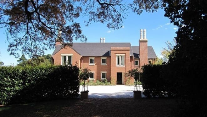 Gardens, mudrooms, grand gates, private lakes and fire places: Southern Highlands trophy home requisites