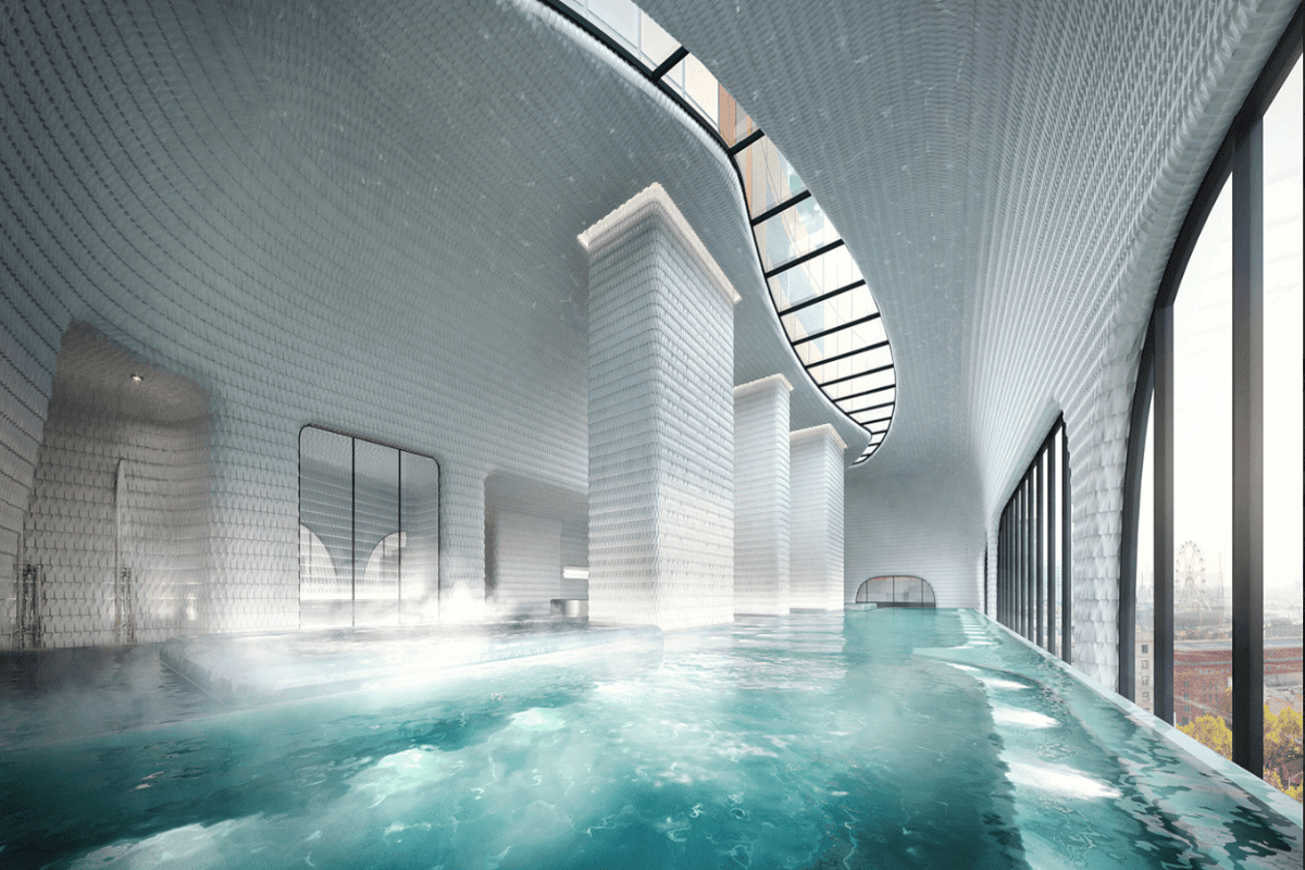The Aspire heated infinity pool with city views and curved sky light.
