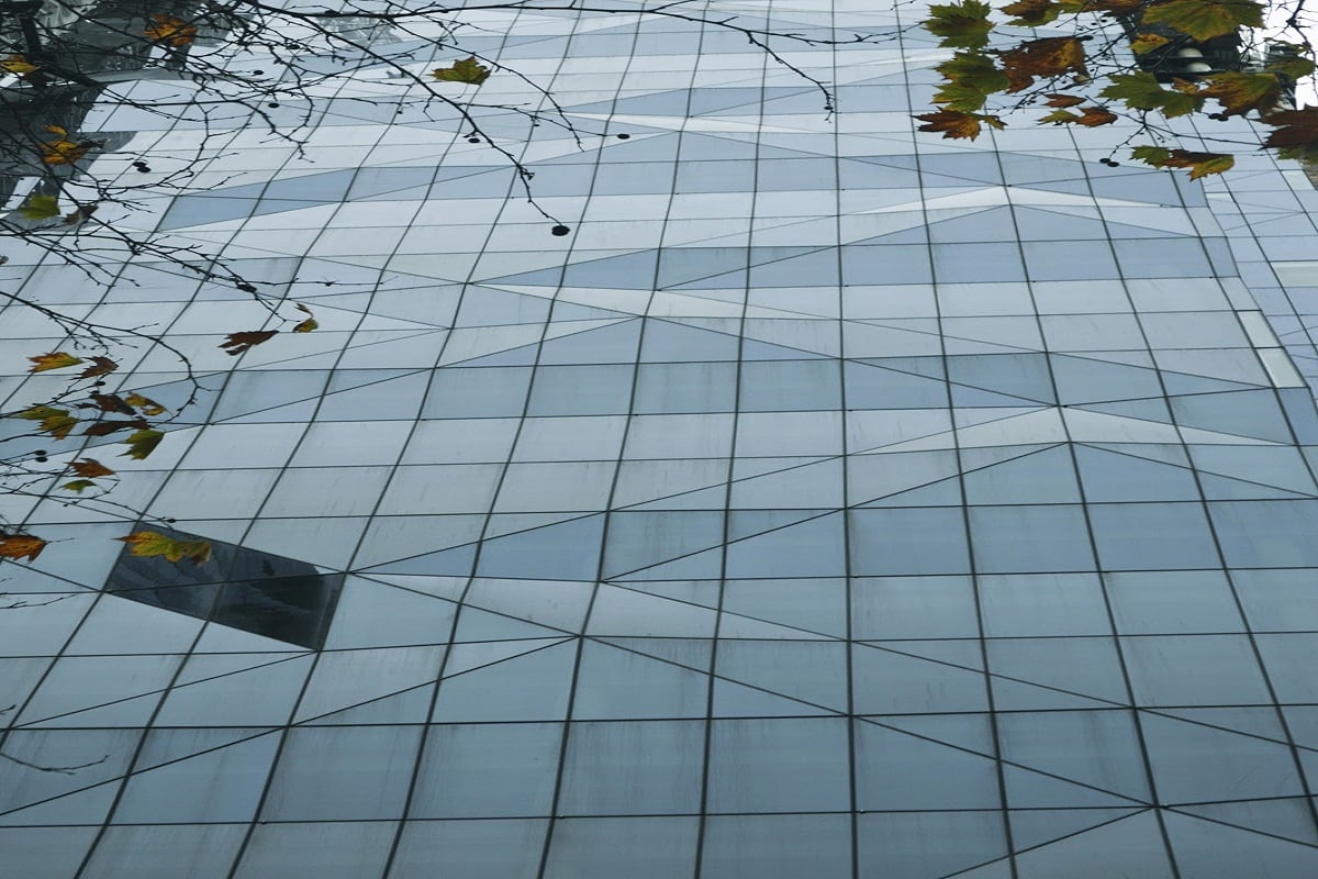 The geometric glass facade of 80 Collins Street. Image by Nick Failla.