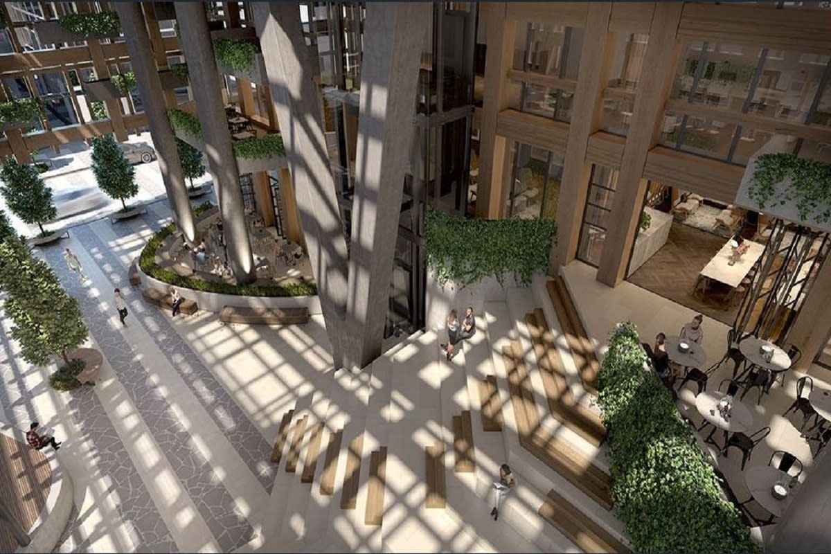 Yarra One’s three floor public workspace featuring natural stone, timber and greenery.