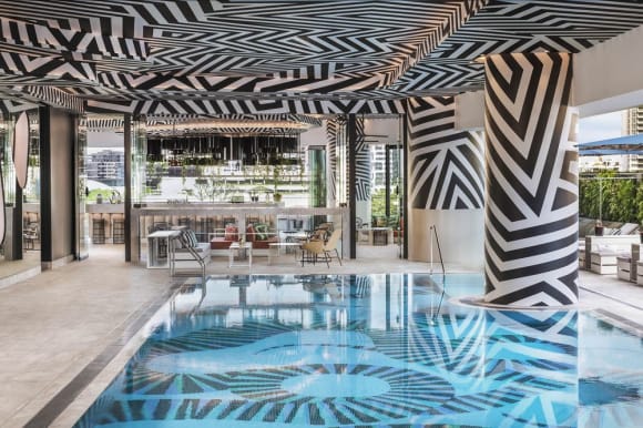 The zebra patterned pool Brisbane stepping into its own as a tropical hotel destination