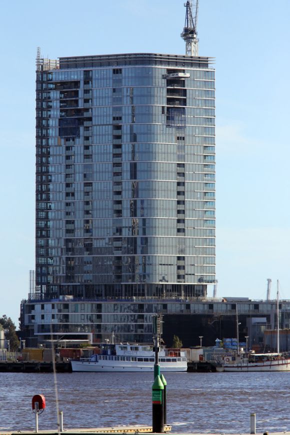 The 30-storey Forge nears completion at Wharfs Entrance. Photo: Sydney Struwig Mirvac's Forge tops out with Voyager on the horizon