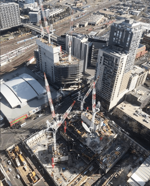 Two sites, three towers, eight cranes. Image: Probuild Probuild tops out at 271 Spring Street