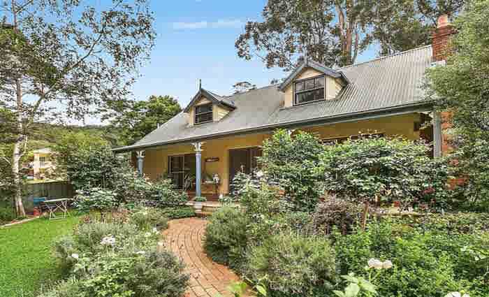 Former Socceroo George Harris lists Woonona home