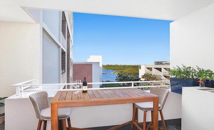 Bachelor contestant Bec Chin and Dean Vicelich sell at Wentworth Point