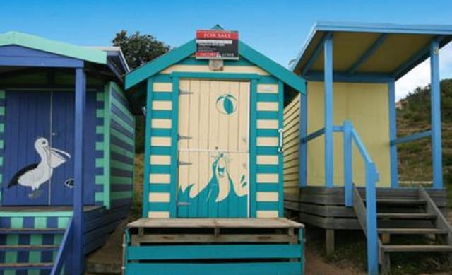 Freshly painted bathing box at the Mornington Peninsula listed for sale