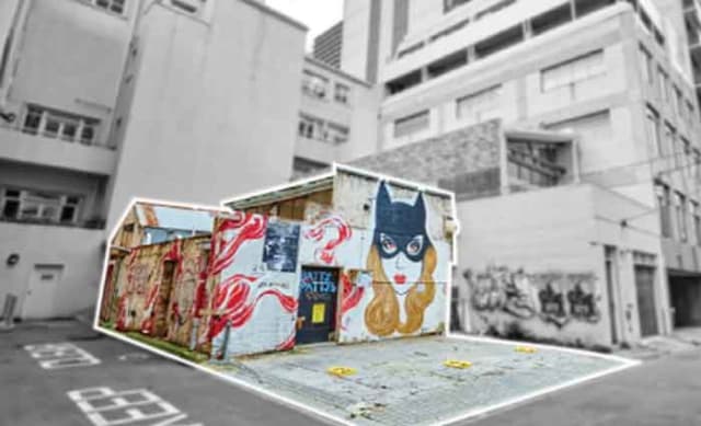 Laneway warehouse adorned with cat woman graphic sold in Melbourne