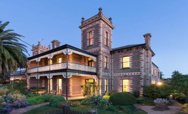 Coburg mansion, built as a mirror-image of next door, listed for sale 