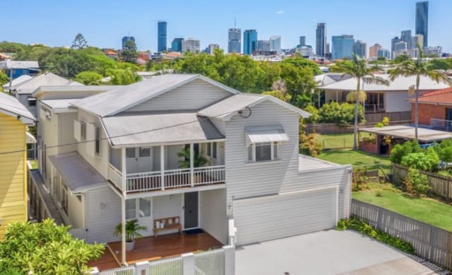 Former Socceroo Brett Holman lists Brisbane home