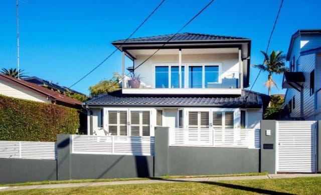 Swans coach John Longmire moves up the street in Malabar