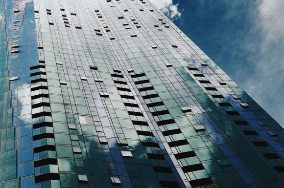 Swanston Central’s vertical grid of pink, green and a silver hue glass facade. Image by Nick Failla. Swanston Central construction update