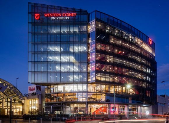 100 Macquarie Street in an evening glow. Image: Woods Bagot Profiling Woods Bagot's role in Western Sydney University's new Liverpool campus