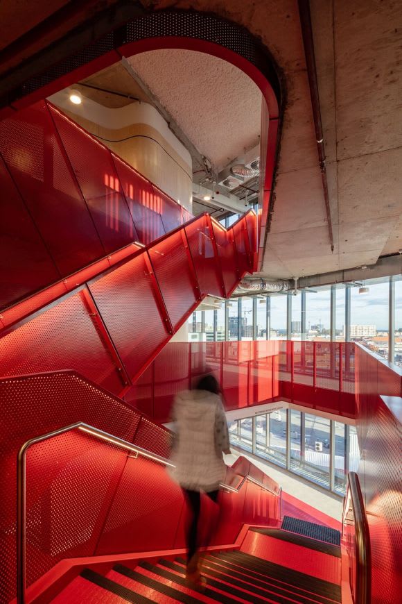 The signature red staircase. Image: Woods Bagot Profiling Woods Bagot's role in Western Sydney University's new Liverpool campus