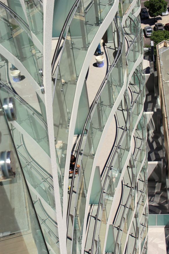Reflections upon reflection. The undulating exterior In focus > The Emerald @ 35 Albert Road, Melbourne