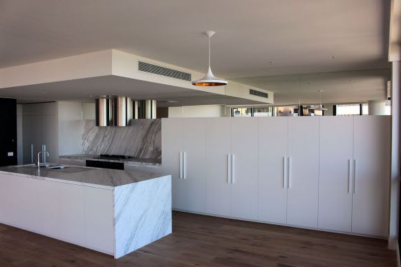 Penthouse kitchen featuring marble finishes In focus > The Emerald @ 35 Albert Road, Melbourne