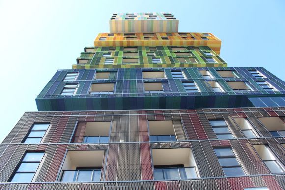 View looking up at the stacked boxes and overhangs. An Icon complete