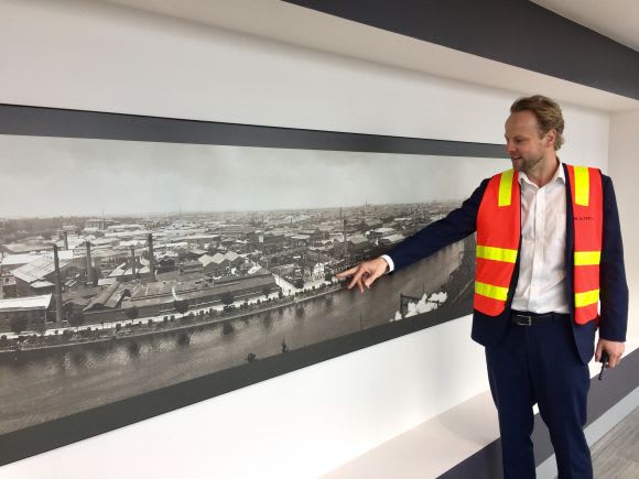 Jeremy pointing out one of the selected artworks displayed on level 41 Jeremy pointing out one of the selected artworks displayed on level 41