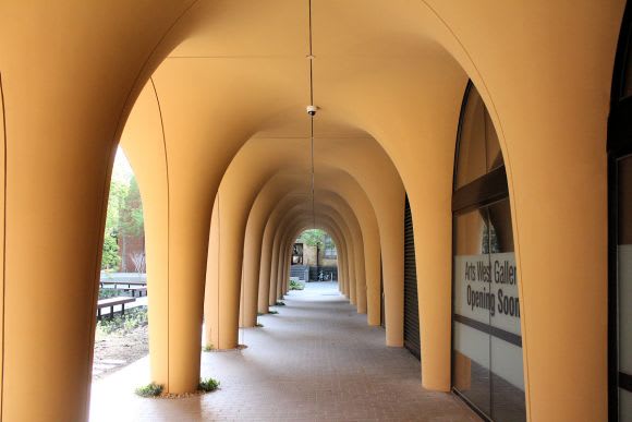 Arts West's recessed ground level Arts West fits best for Melbourne University