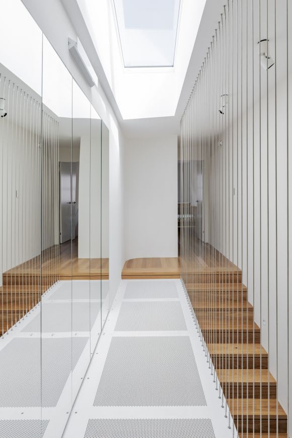 "Lightwell staircase" features a mirrored wall to give the illusion of more space. Credit: NIcholas Gurney Is Australia ready for smaller footprint apartment living?
