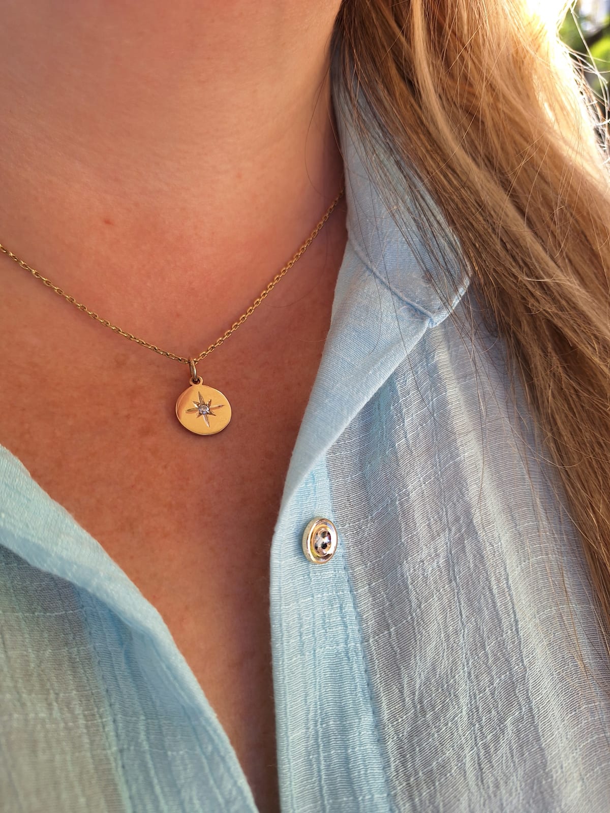 DIJE ESTRELLA DE LUZ EN ORO 18 K Y DIAMANTE