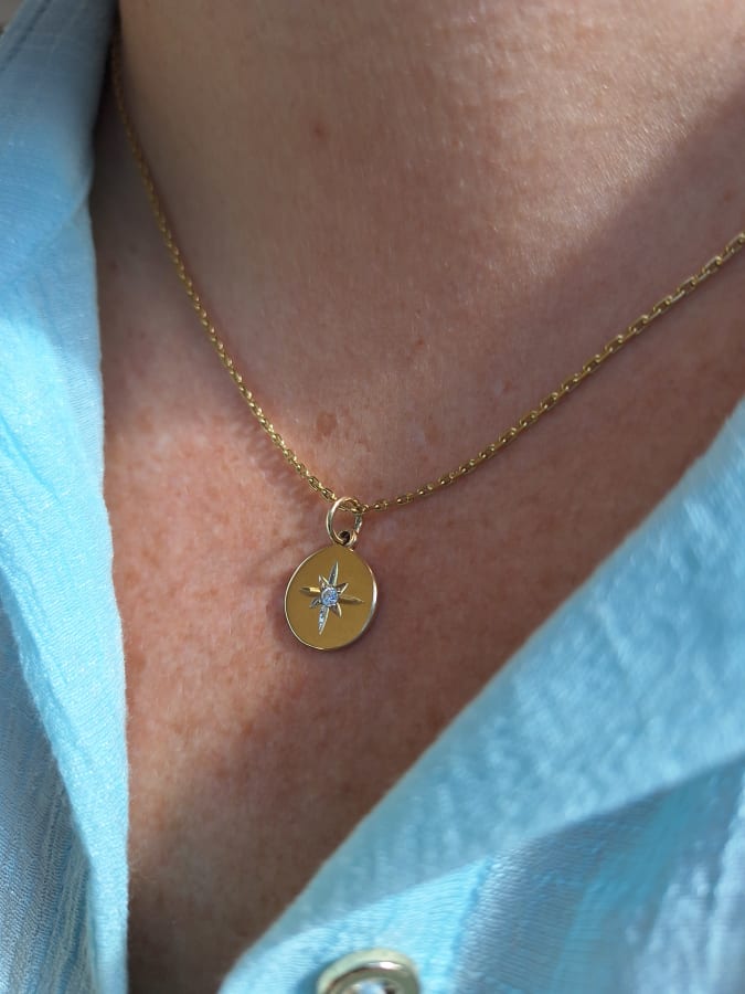 ESTRELLA DE LUZ PLATA CON BAÑO DE ORO 18k