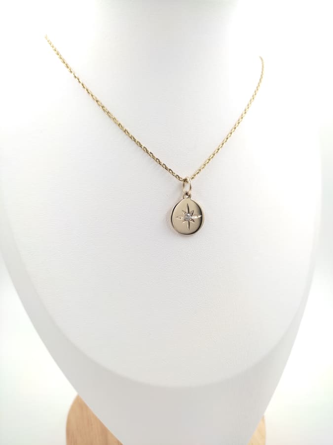 ESTRELLA DE LUZ PLATA CON BAÑO DE ORO 18k
