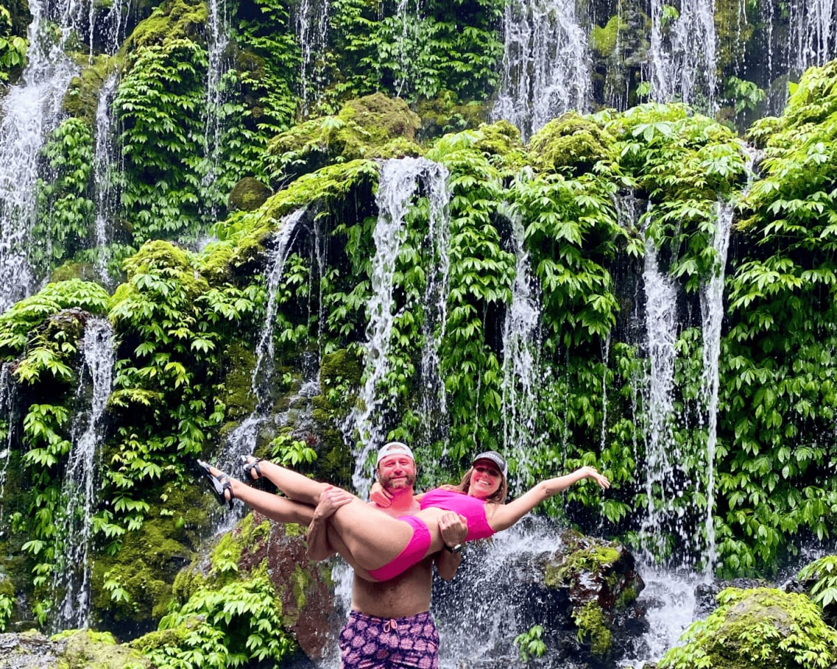 The Travsessed founders enjoying a lush hidden waterfall in Bali
