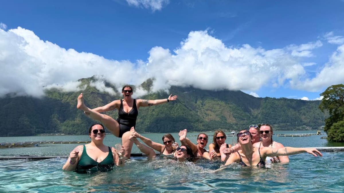 Travelers relaxing in a mountain hot spring during a Bali stay