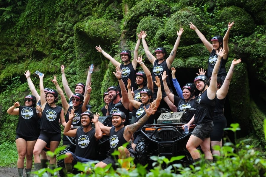 A Travsessed group celebrating after an ATV adventure through Bali