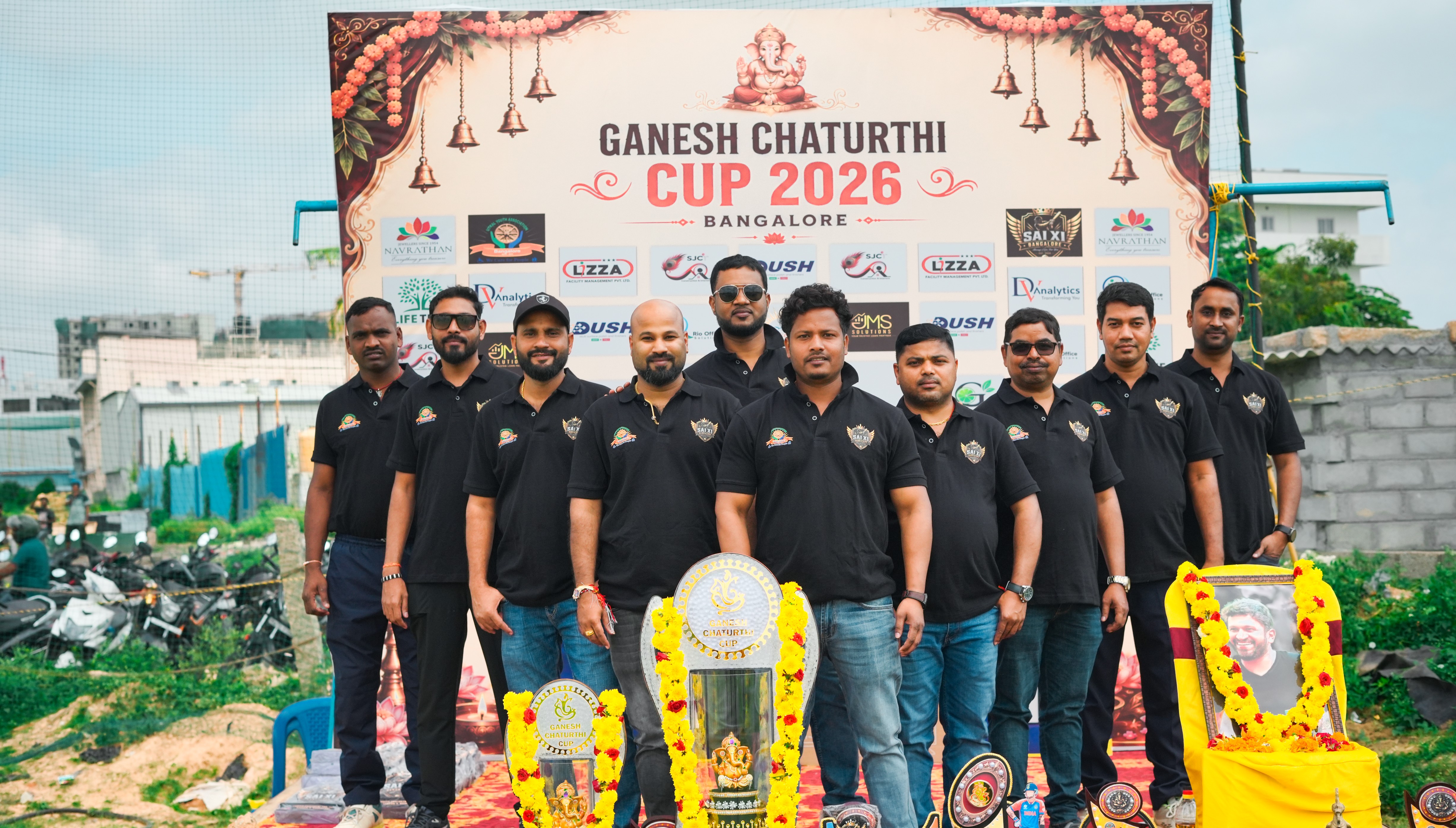 Ganesh Chaturthi Cup team posing with trophies at the 2026 tournament