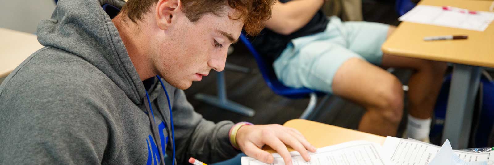 IMG male student in classroom