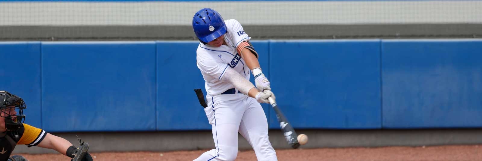 IMG baseball player swinging bat