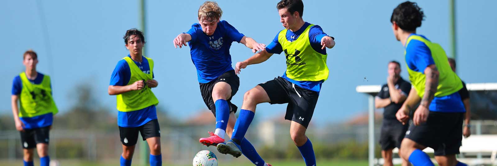 IMG male soccer players on field