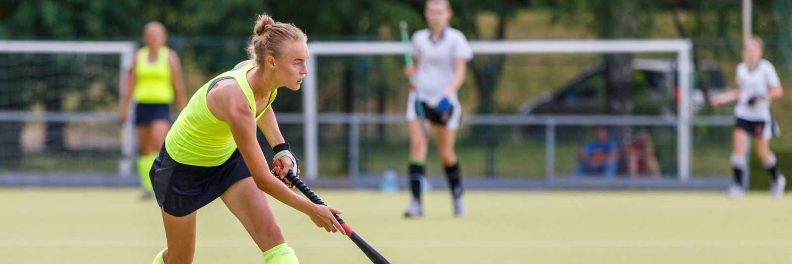 Field hockey player making a pass