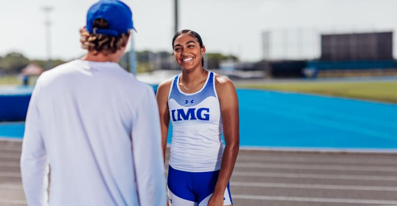 Coach talking to athlete