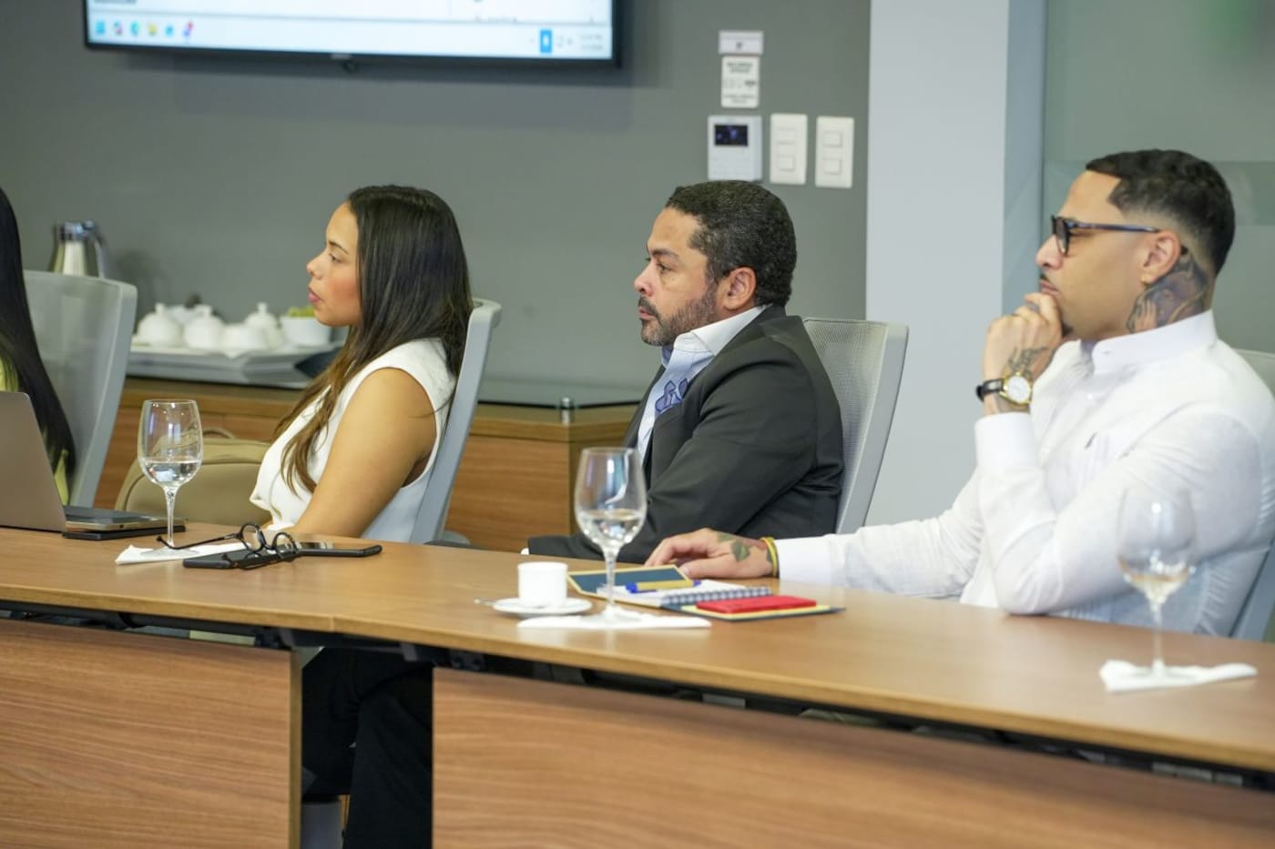 Professionals participating in an institutional strategy session around a conference table