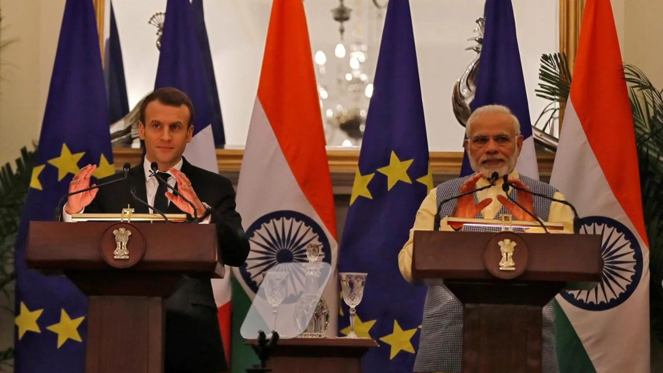 "Prime Minister Narendra Modi shaking hands with French President at VivaTech Paris summit, symbolizing India-France tech partnership and diplomatic ties."
