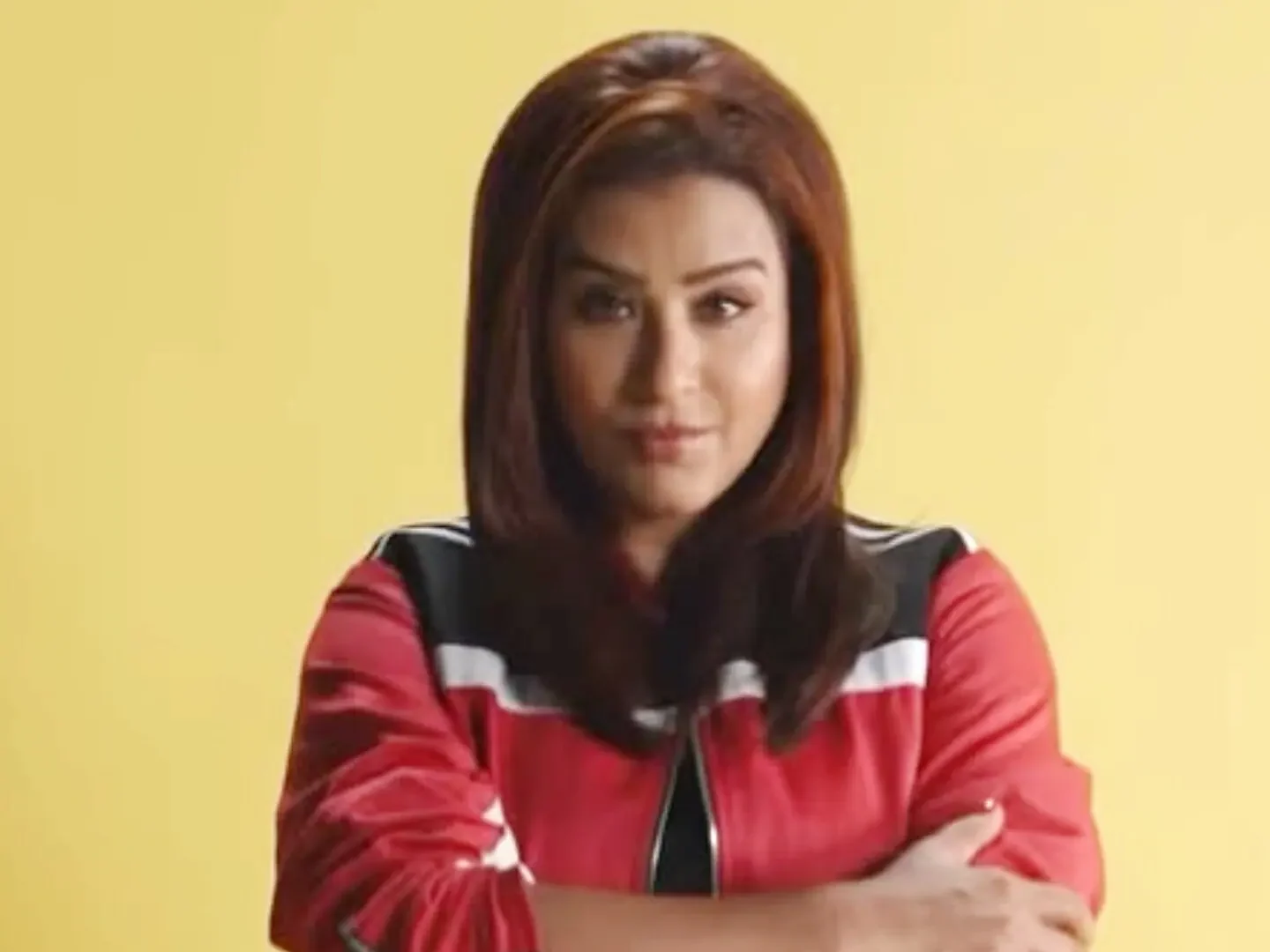 "Shilpa Shinde poses in a red and black jacket in a promotional image for Lock Upp 2, ahead of her highly anticipated wildcard entry into the reality show."