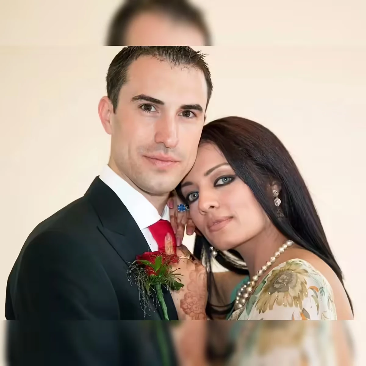 "Celina Jaitly and Peter Haag pose together in a portrait from their marriage, featured in coverage of the actress's divorce interview and legal proceedings."