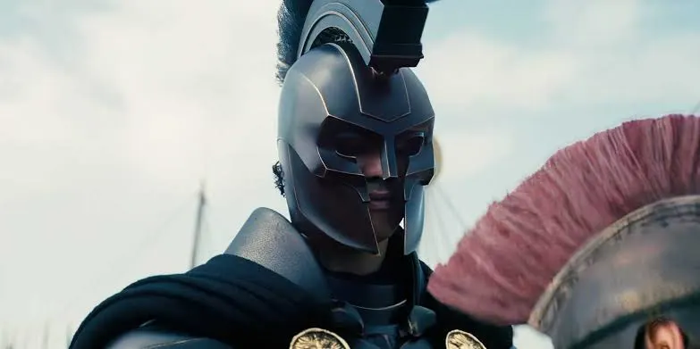 "Matt Damon as Odysseus in Christopher Nolan's The Odyssey, wearing ancient Greek warrior armor on a battlefield during the epic adventure film."