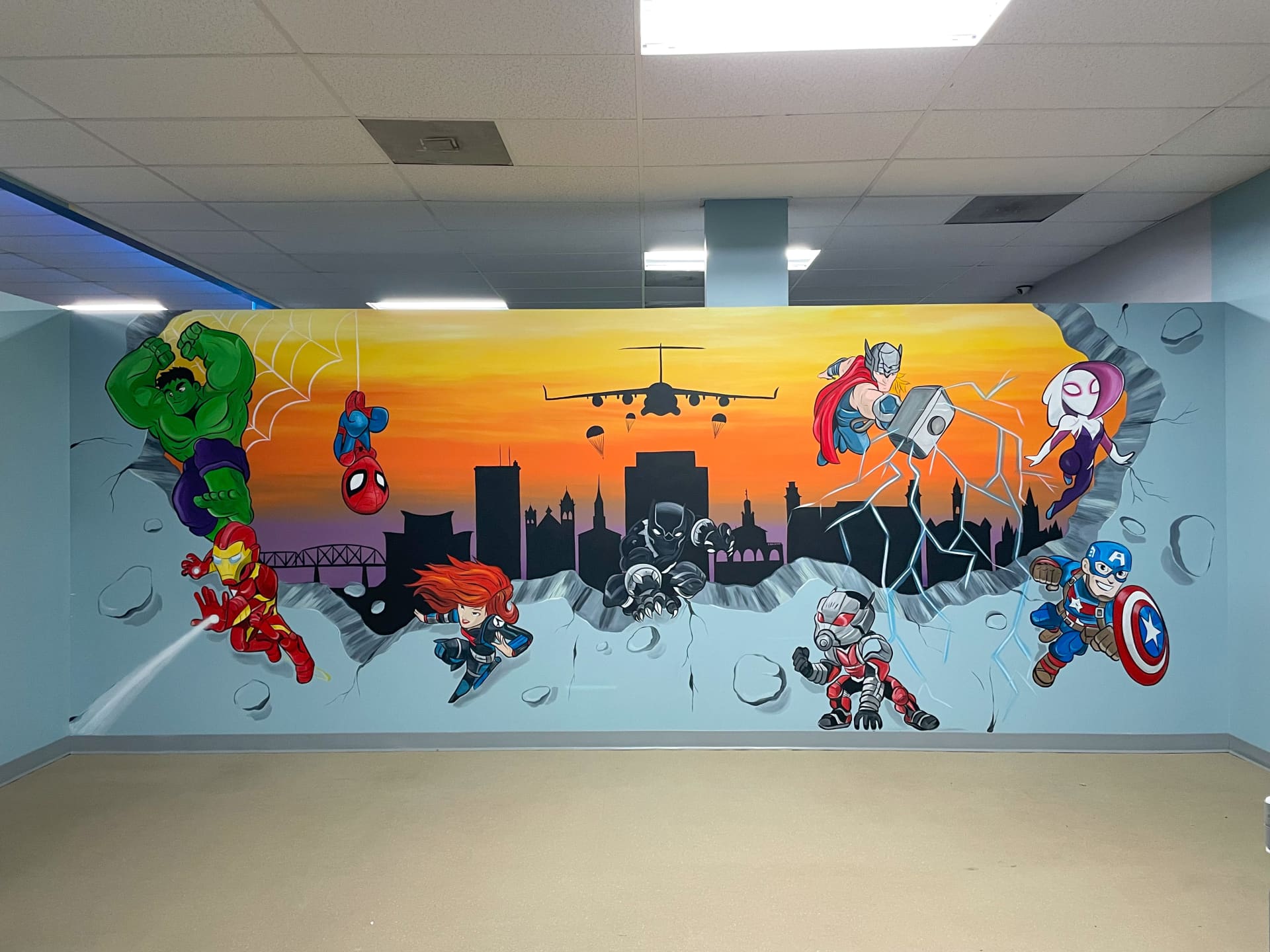 Super hero and Fayetteville skyline