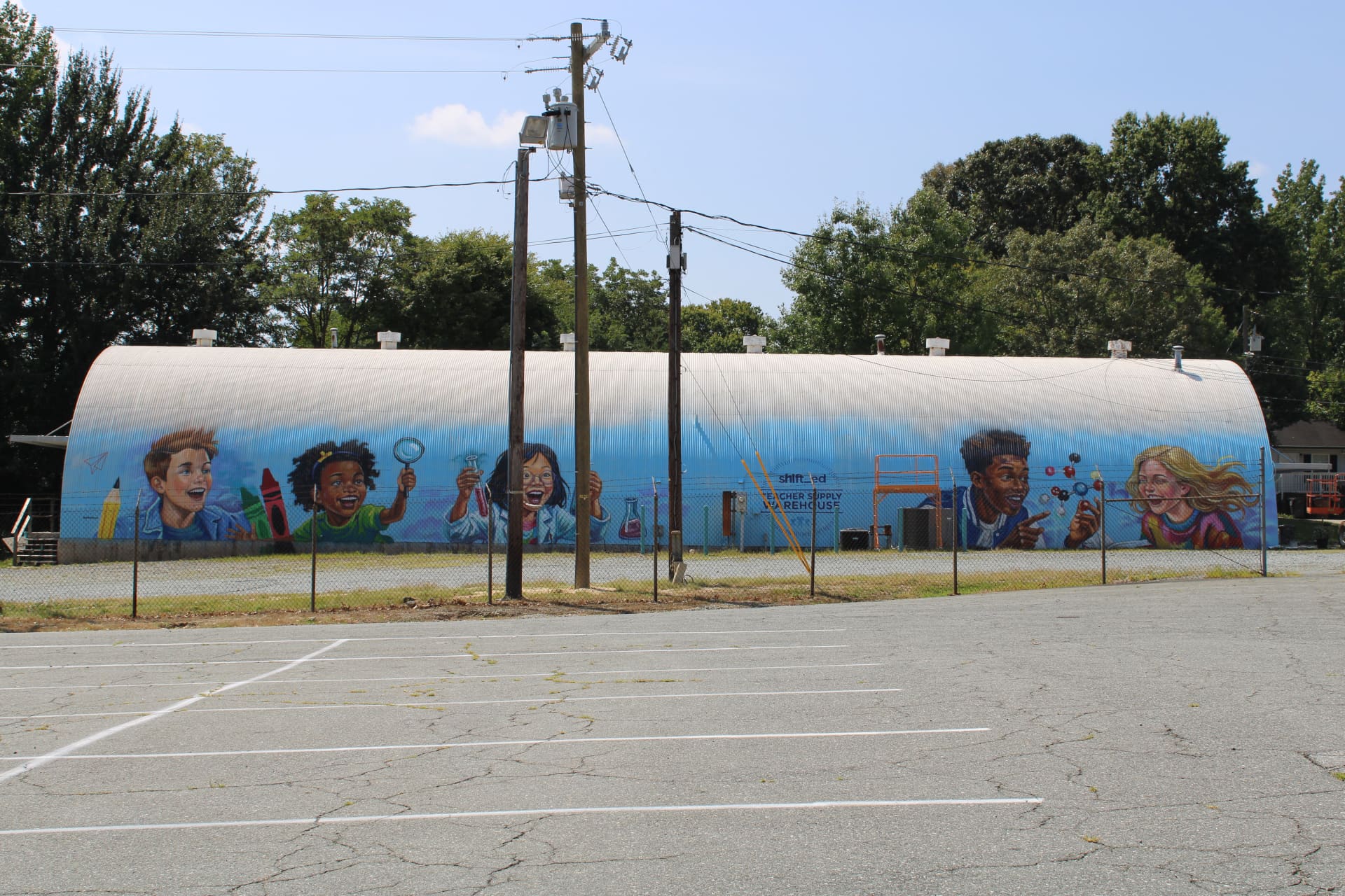 Curiosity Ignites Young Minds on Warehouse Wall