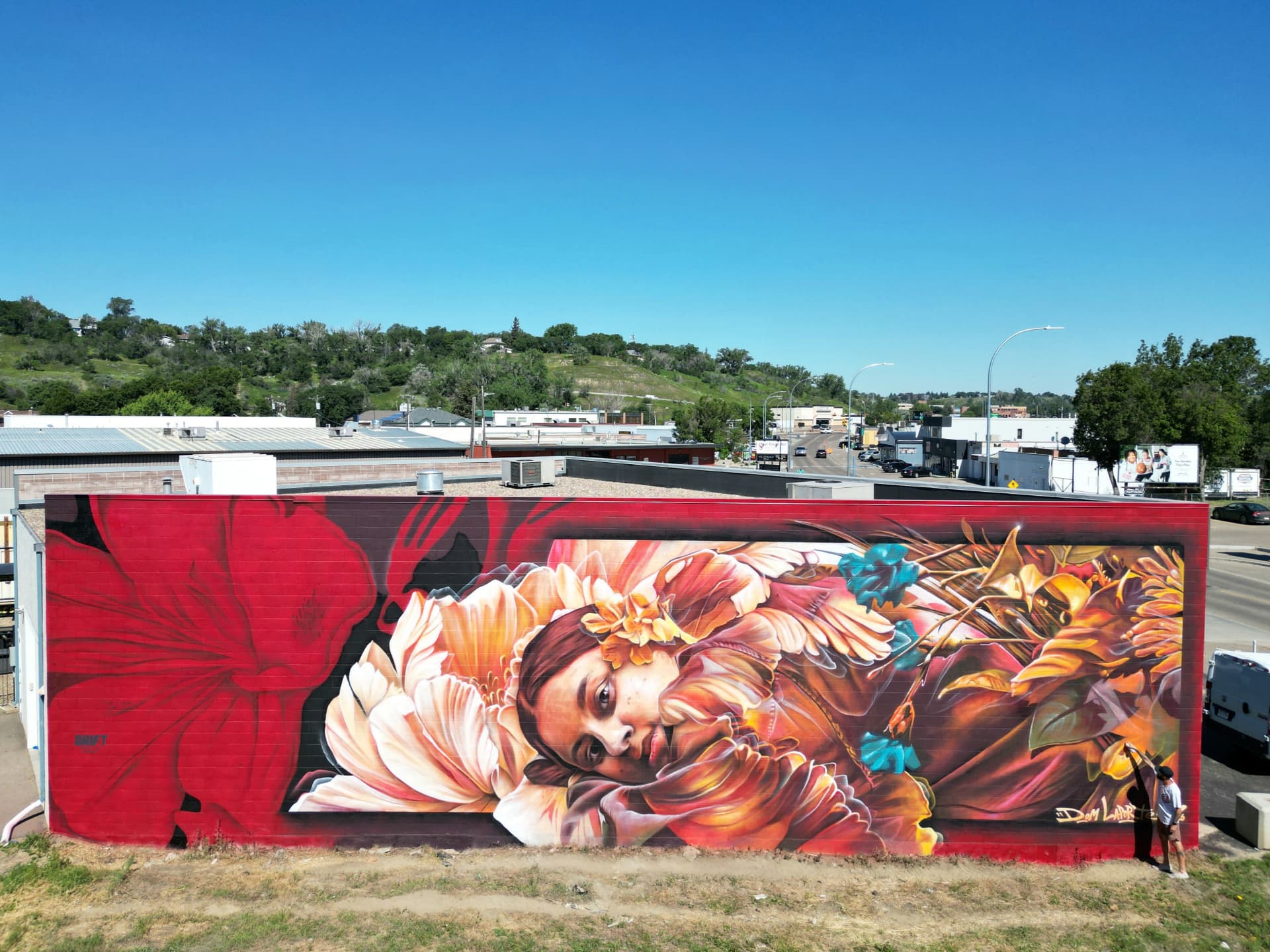 Winged figure among blooming florals