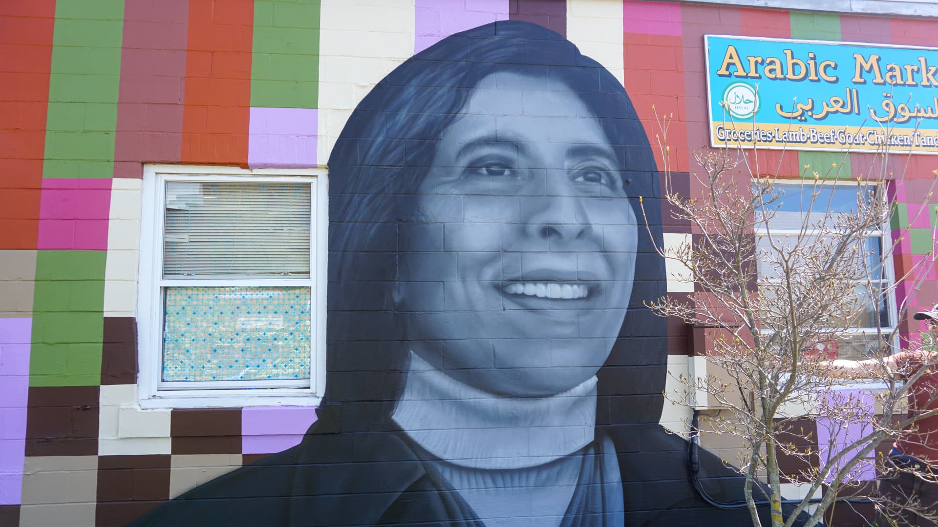 Radiant Smiles Amidst Colorful Community Tapestry