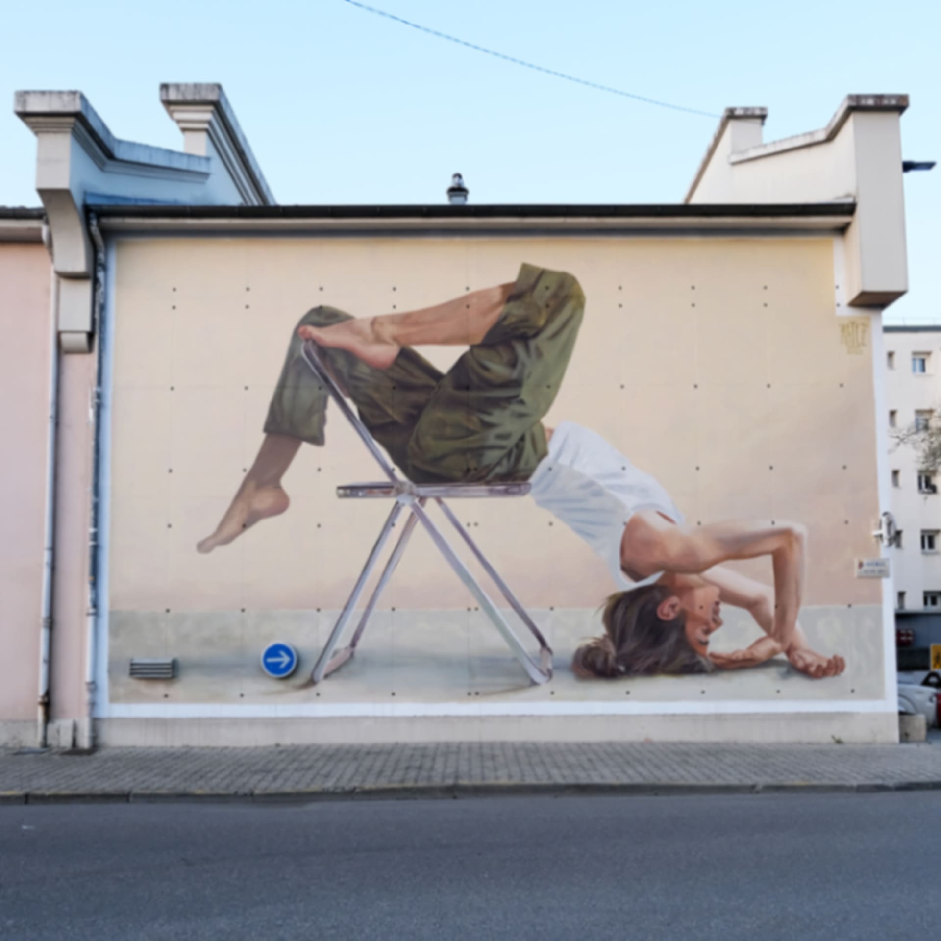 Composition with a human body and a metal chair by Artez