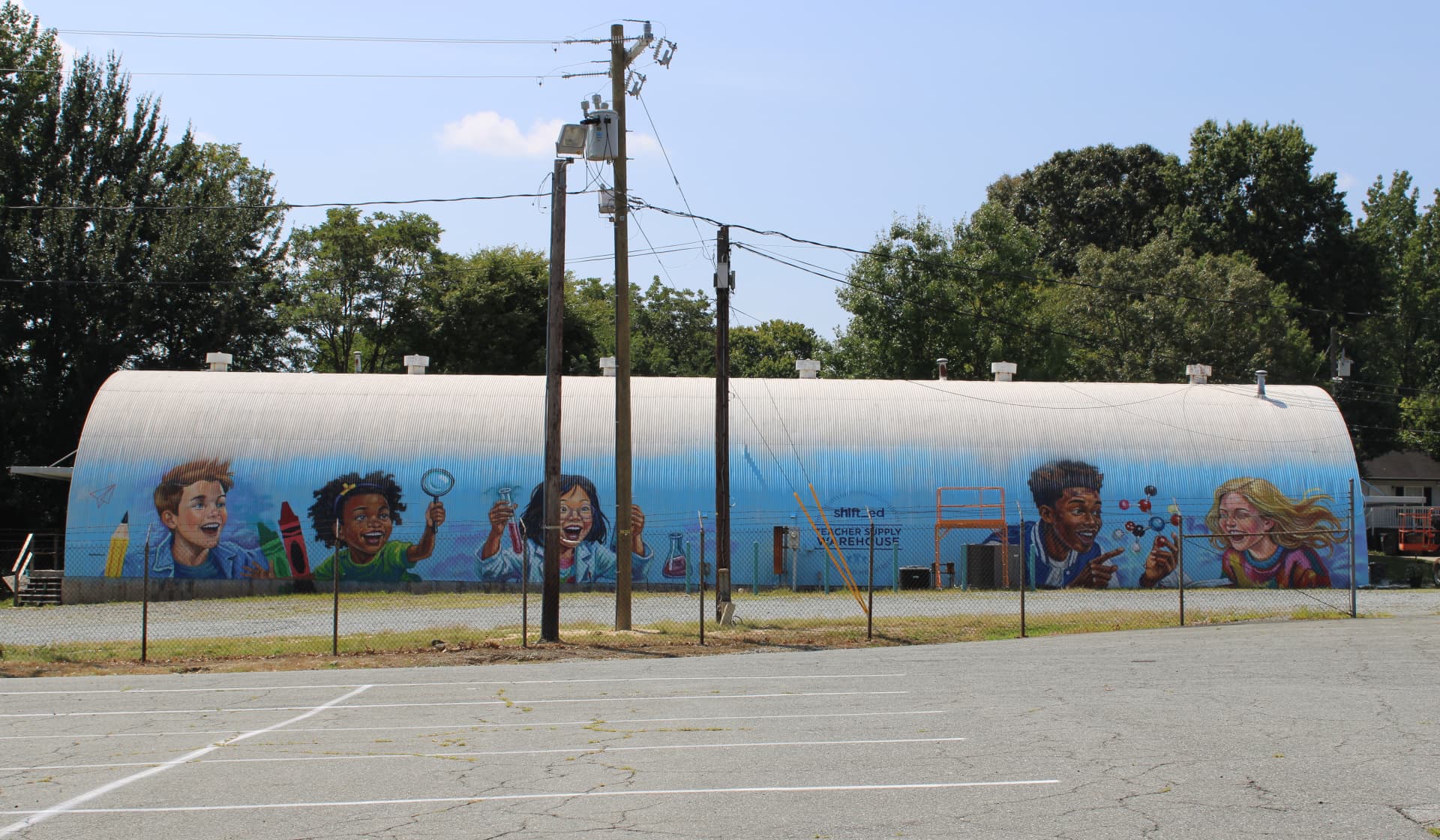Curiosity Ignites Young Minds on Warehouse Wall