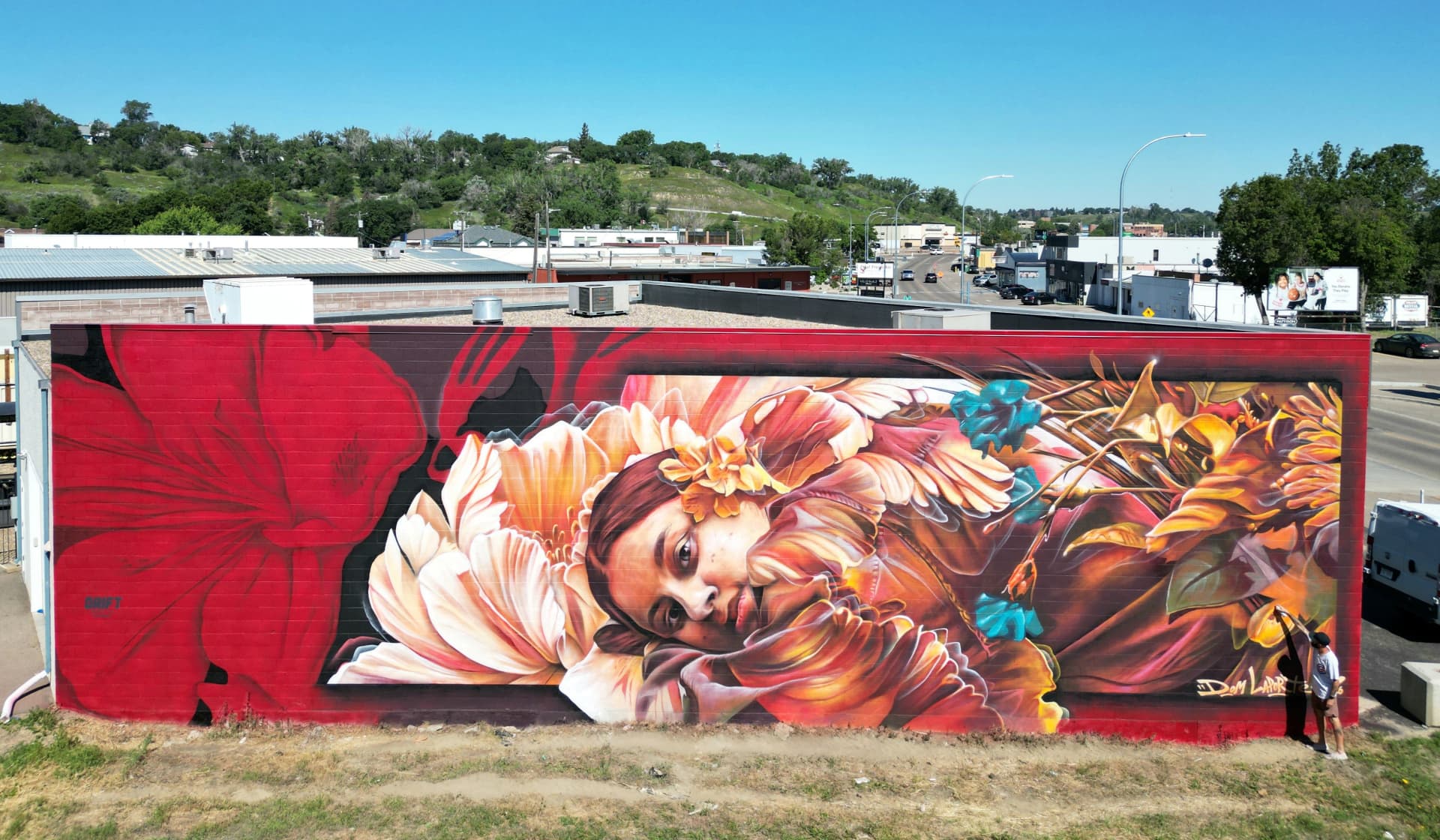 Winged figure among blooming florals