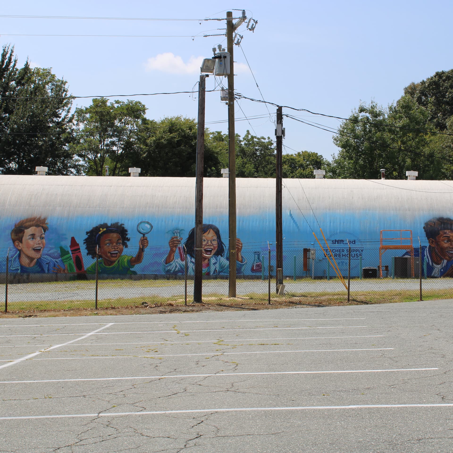 Curiosity Ignites Young Minds on Warehouse Wall detail