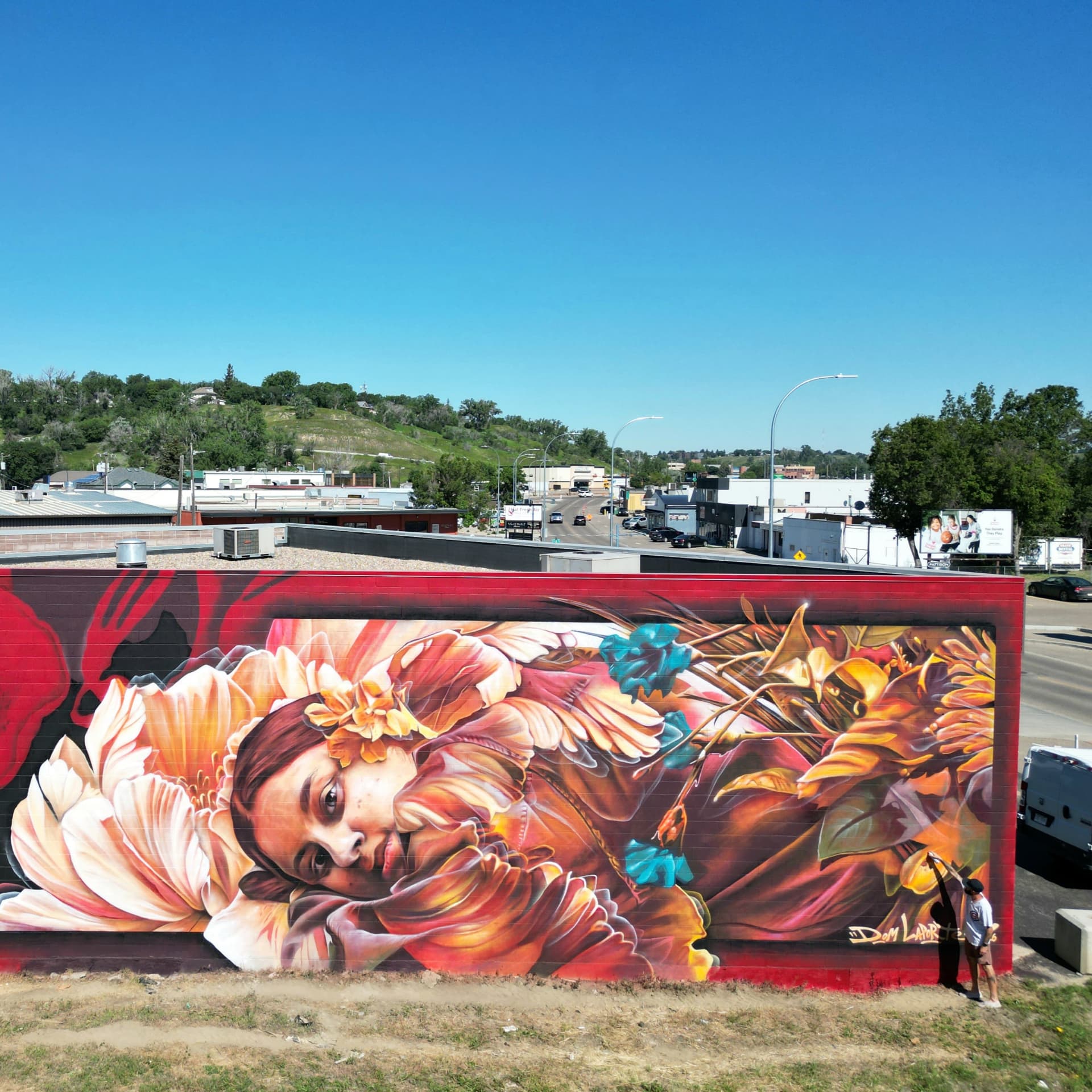 Winged figure among blooming florals detail
