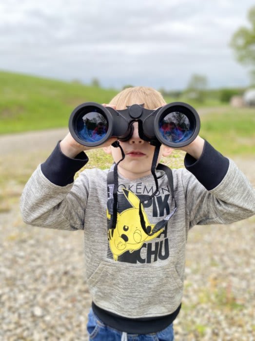 Our oldest son, Bennett staring back at us through binoculars